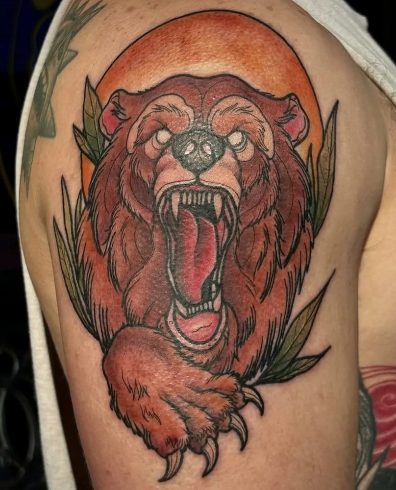 Neo-traditional roaring bear against an orange sun with foliage